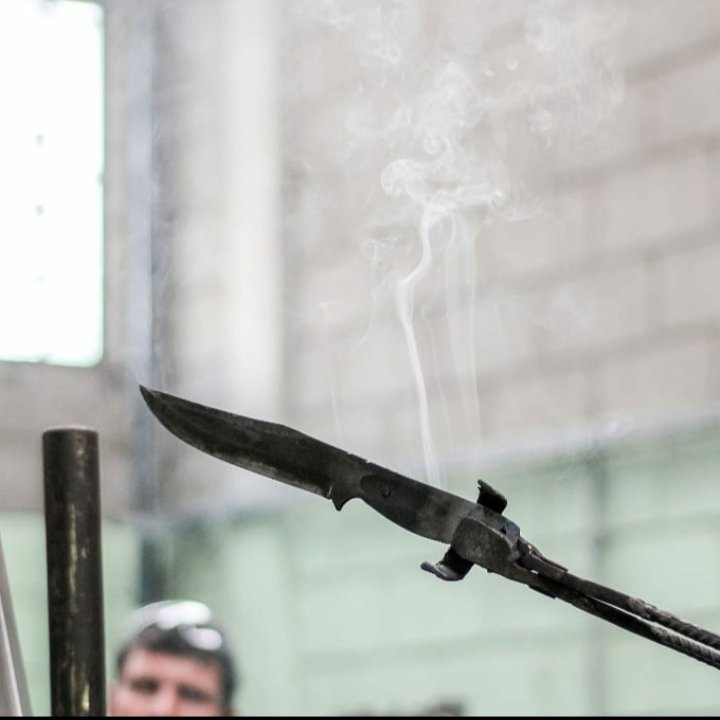 Custom Knife Coming Out of Oil Quench